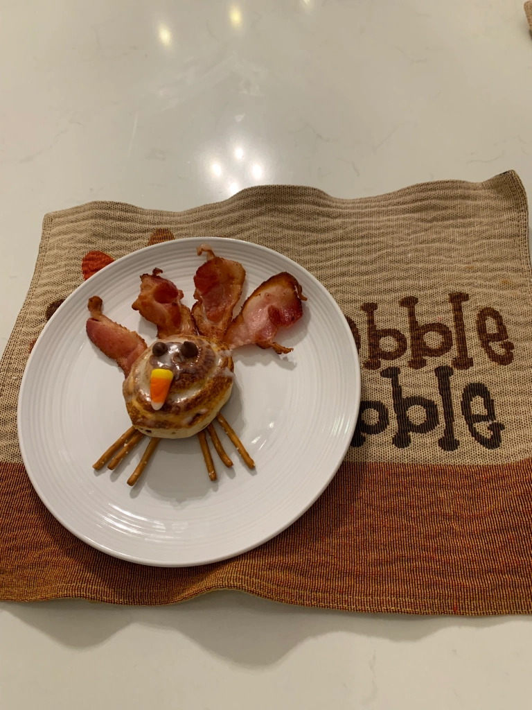 cinnamon roll turkeys on gobble gobble place mats ready to eat